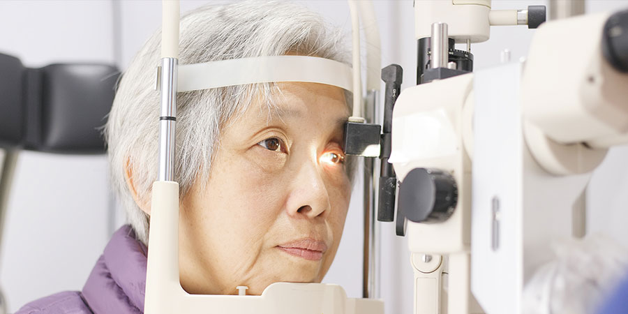 Senior woman reading with glasses